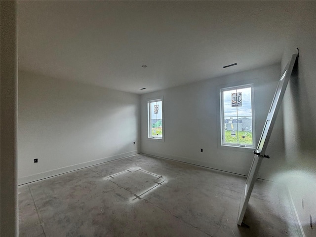 305 NW Woodmoor Dr, Waukee, IA 50263 - empty room with baseboards