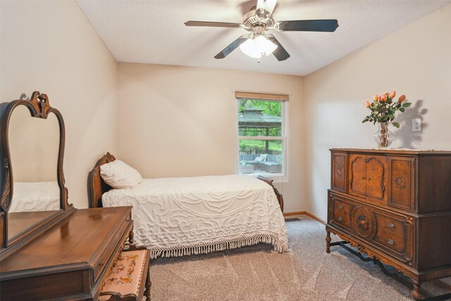 5200 Pine Valley Dr, Pleasant Hill, IA 50327 - carpeted bedroom with baseboards, a ceiling fan, and a textured ceiling