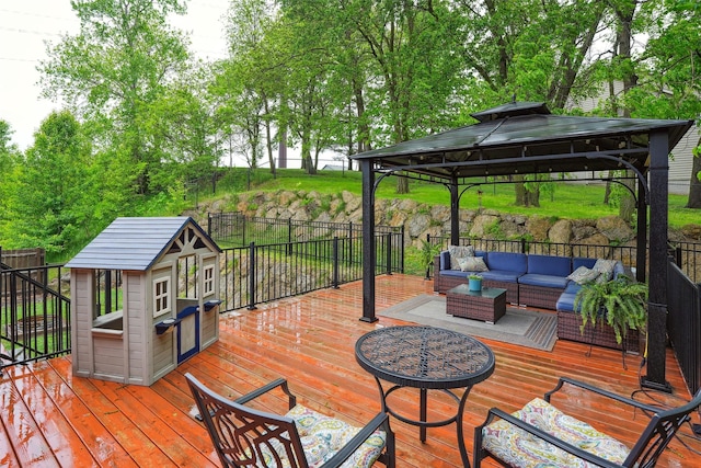5200 Pine Valley Dr, Pleasant Hill, IA 50327 - wooden terrace featuring an outdoor living space, a gazebo, and an outbuilding