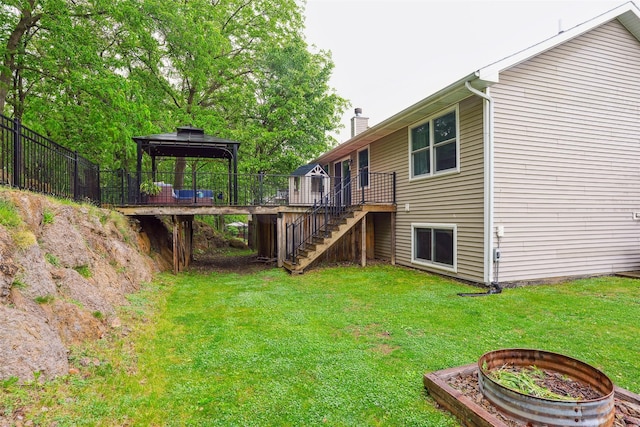 5200 Pine Valley Dr, Pleasant Hill, IA 50327 - view of yard with stairs, a gazebo, a wooden deck, and a fire pit