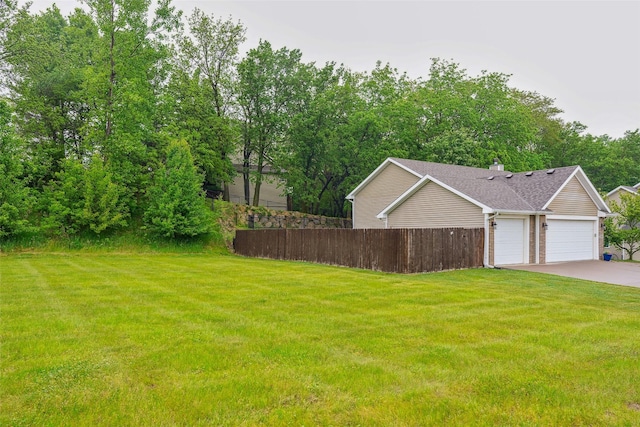 5200 Pine Valley Dr, Pleasant Hill, IA 50327 - view of yard with a garage and driveway