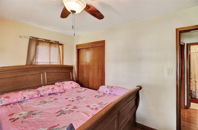 3517 50th St, Des Moines, IA 50310 - bedroom with a closet, wood finished floors, and ceiling fan