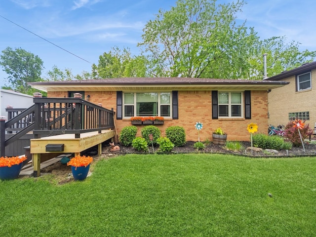 4022 Clinton Ave, Des Moines, IA 50310 - view of front of home featuring brick siding, a front lawn, and a wooden deck