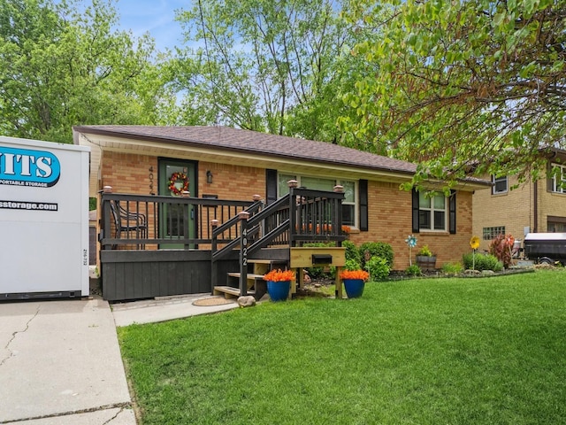 4022 Clinton Ave, Des Moines, IA 50310 - ranch-style house with brick siding and a front lawn