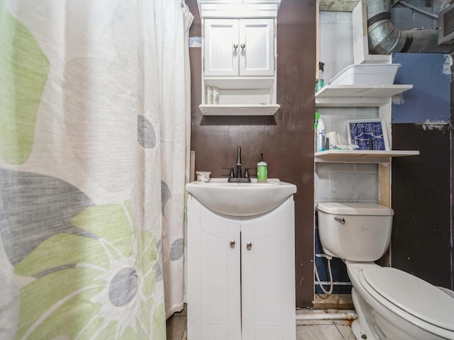 4022 Clinton Ave, Des Moines, IA 50310 - bathroom featuring toilet, vanity, and a shower with shower curtain