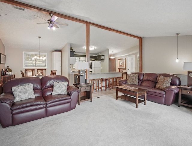5113 Panorama Dr, Panora, IA 50216 - carpeted living room with a ceiling fan, a chandelier, and vaulted ceiling