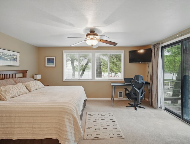 5113 Panorama Dr, Panora, IA 50216 - carpeted bedroom featuring access to exterior, baseboards, and ceiling fan
