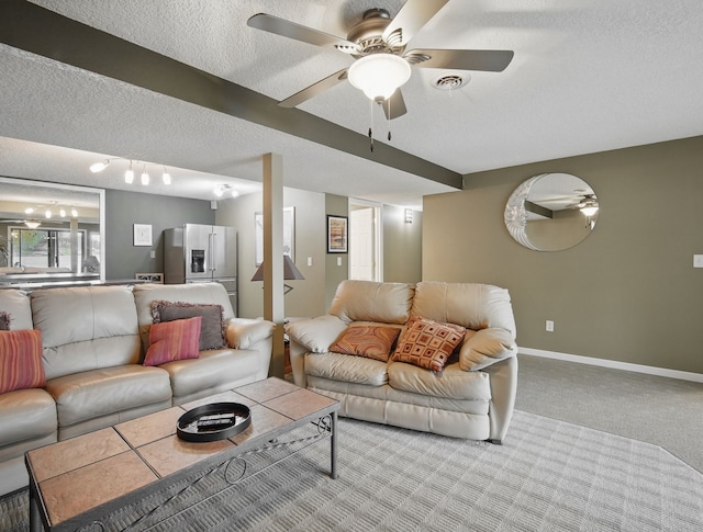 5113 Panorama Dr, Panora, IA 50216 - living room with a textured ceiling, carpet flooring, ceiling fan, and baseboards