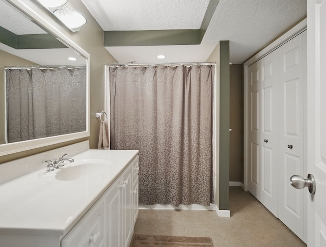 5113 Panorama Dr, Panora, IA 50216 - full bath featuring vanity, a textured ceiling, a shower with shower curtain, and baseboards