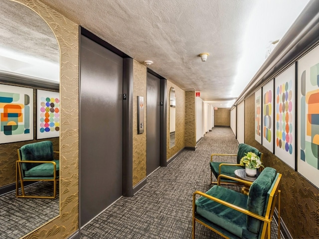 3663 Grand Ave Unit 508, Des Moines, IA 50312 - hallway with carpet floors, a textured ceiling, and elevator