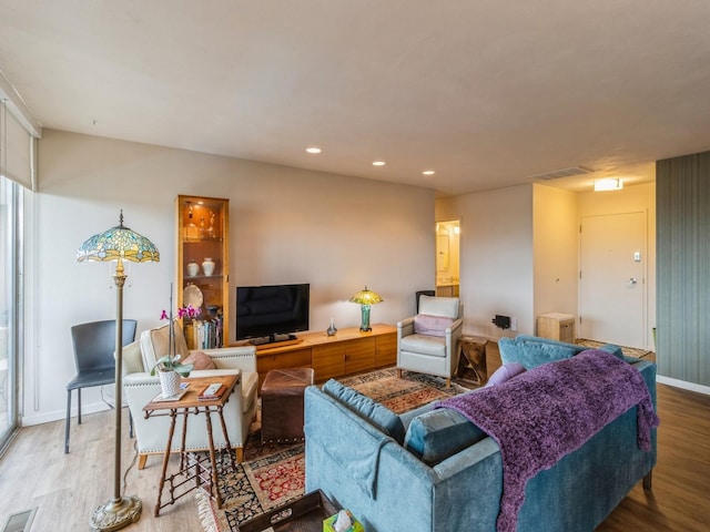 3663 Grand Ave Unit 508, Des Moines, IA 50312 - living room featuring wood finished floors, recessed lighting, and baseboards