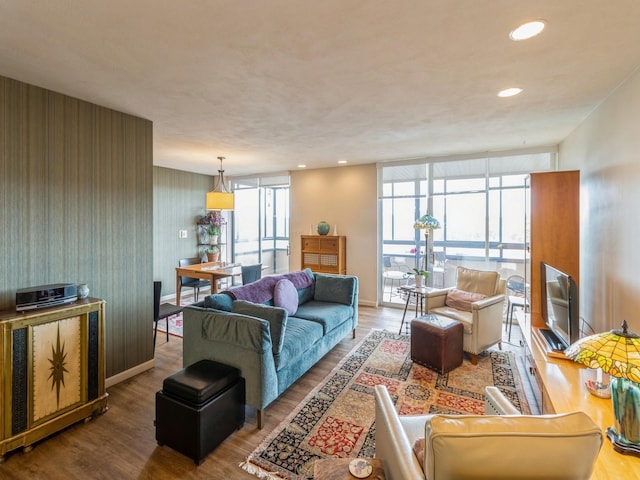 3663 Grand Ave Unit 508, Des Moines, IA 50312 - living area with wood finished floors, baseboards, and recessed lighting
