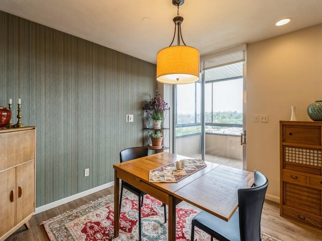 3663 Grand Ave Unit 508, Des Moines, IA 50312 - dining area featuring light wood-style floors, wallpapered walls, baseboards, and recessed lighting