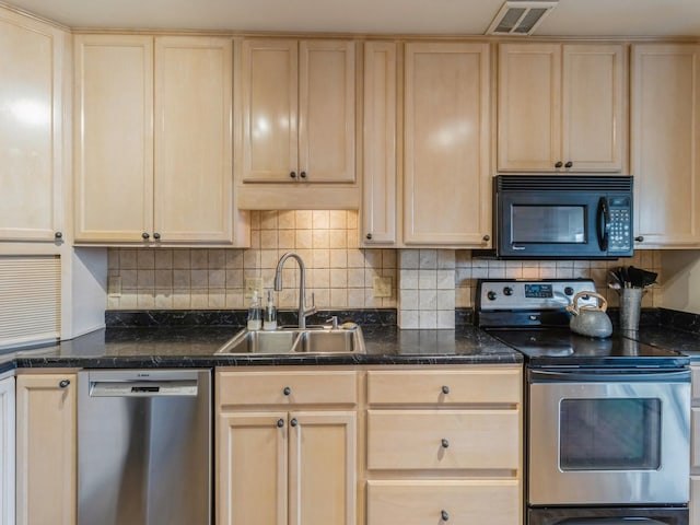 3663 Grand Ave Unit 508, Des Moines, IA 50312 - kitchen featuring appliances with stainless steel finishes, light brown cabinets, a sink, and tasteful backsplash