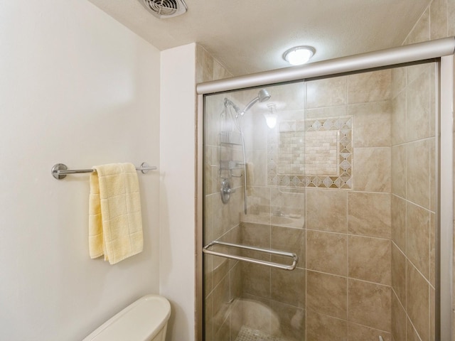 3663 Grand Ave Unit 508, Des Moines, IA 50312 - bathroom with a stall shower and toilet