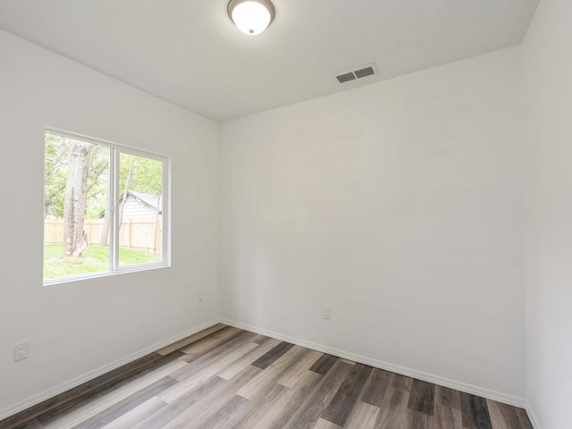2917 2nd Ave, Des Moines, IA 50313 - unfurnished room with wood finished floors and baseboards