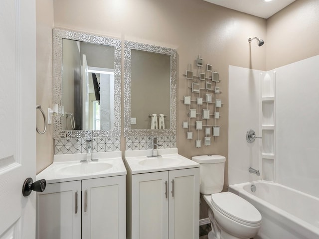2917 2nd Ave, Des Moines, IA 50313 - full bathroom with two vanities, bathing tub / shower combination, and toilet