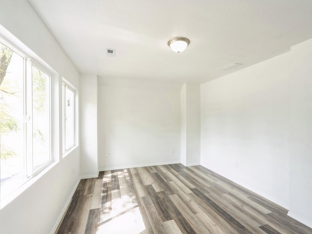 2917 2nd Ave, Des Moines, IA 50313 - unfurnished room with wood finished floors and baseboards