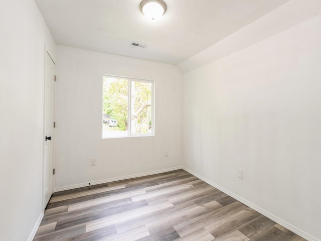 2917 2nd Ave, Des Moines, IA 50313 - spare room with wood finished floors and baseboards