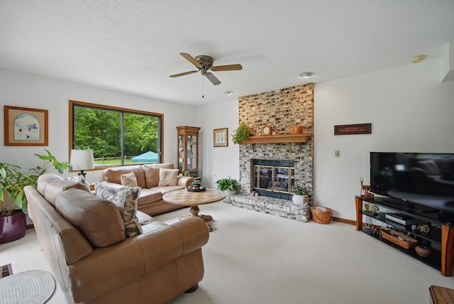 1011 NE 60th Ave, Des Moines, IA 50313 - carpeted living room featuring a ceiling fan, a brick fireplace, and a textured ceiling