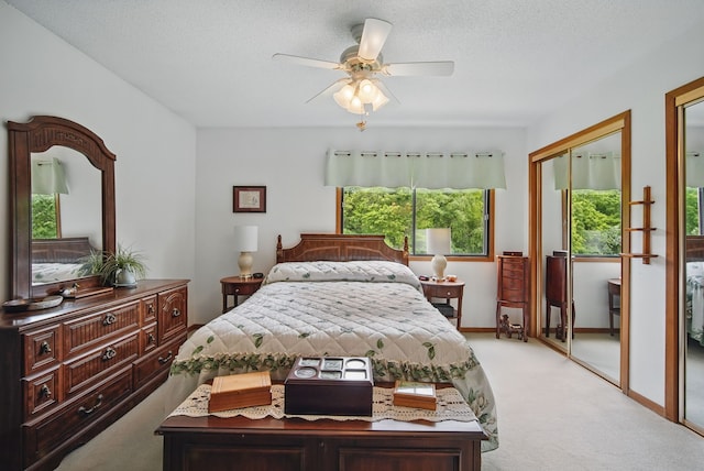 1011 NE 60th Ave, Des Moines, IA 50313 - carpeted bedroom featuring ceiling fan, baseboards, and a textured ceiling