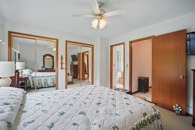 1011 NE 60th Ave, Des Moines, IA 50313 - bedroom with multiple closets, light carpet, ensuite bath, and a ceiling fan