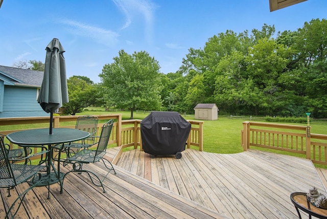 1011 NE 60th Ave, Des Moines, IA 50313 - wooden deck featuring grilling area, a yard, outdoor dining area, and view of wooded area