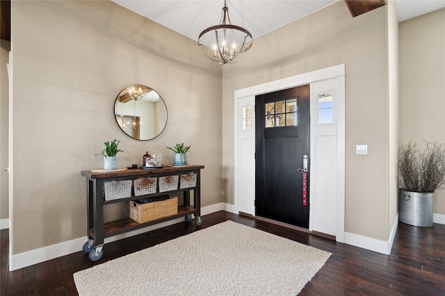 2492 55th St, Vinton, IA 52349 - foyer entrance with baseboards, a chandelier, and dark wood finished floors