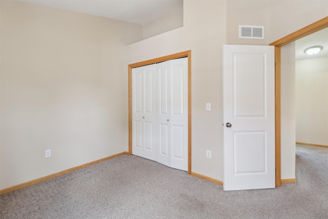 15203 Greenbelt Dr, Urbandale, IA 50323 - unfurnished bedroom with carpet floors, baseboards, and a closet