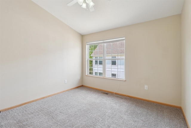 15203 Greenbelt Dr, Urbandale, IA 50323 - carpeted empty room with vaulted ceiling, a ceiling fan, and baseboards