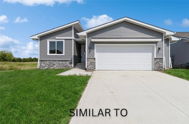 926 Willow Valley Dr, Norwalk, IA 50211 - ranch-style house with an attached garage, driveway, stone siding, and a front yard