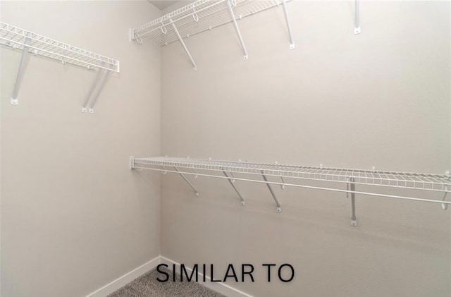 926 Willow Valley Dr, Norwalk, IA 50211 - spacious closet featuring carpet