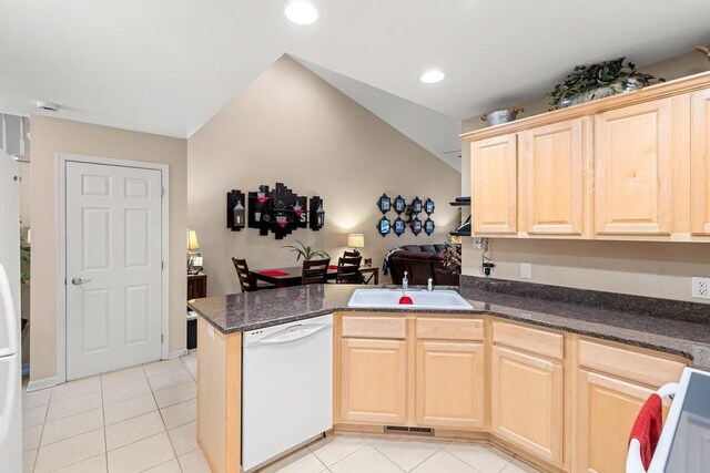 9812 Green View Ln, Johnston, IA 50131 - kitchen featuring white appliances, light brown cabinets, a peninsula, light tile patterned flooring, and recessed lighting