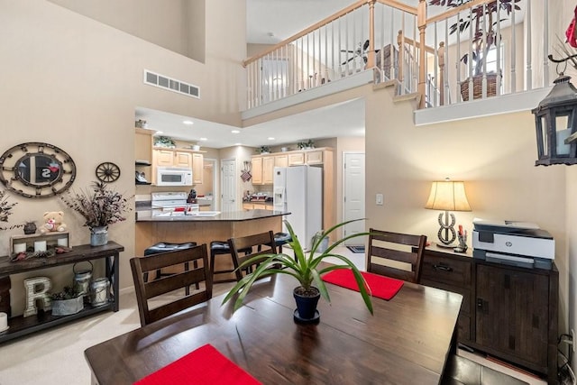 9812 Green View Ln, Johnston, IA 50131 - dining space with a towering ceiling