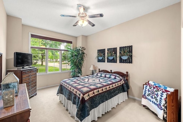 9812 Green View Ln, Johnston, IA 50131 - bedroom with light carpet and a ceiling fan