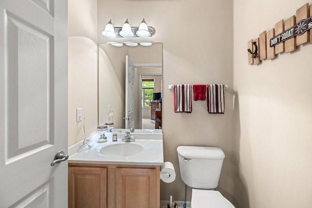 9812 Green View Ln, Johnston, IA 50131 - half bathroom featuring toilet and vanity