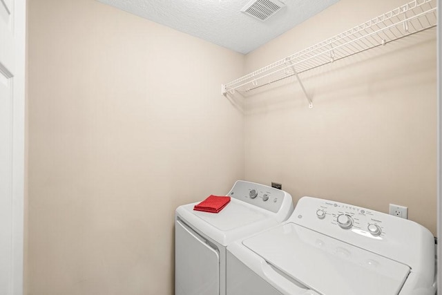 9812 Green View Ln, Johnston, IA 50131 - laundry room featuring washing machine and clothes dryer