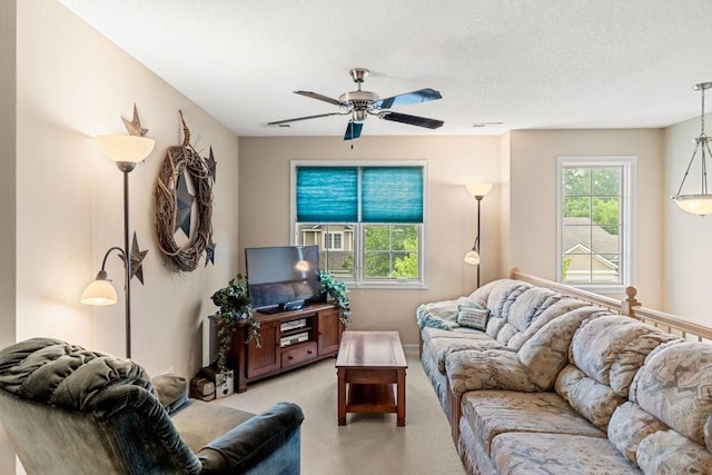 9812 Green View Ln, Johnston, IA 50131 - living room with a ceiling fan, light colored carpet, and a textured ceiling
