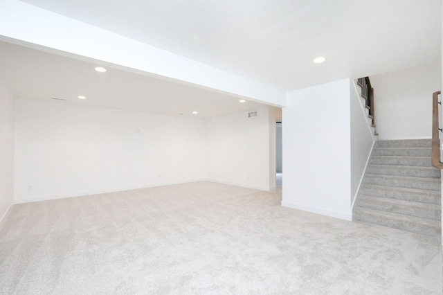 2500 NE 6th St, Grimes, IA 50111 - finished below grade area featuring stairs, light carpet, recessed lighting, and baseboards