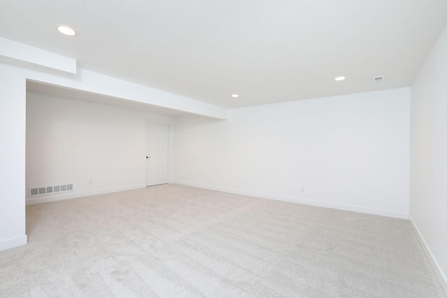 2500 NE 6th St, Grimes, IA 50111 - finished basement with recessed lighting, light carpet, and baseboards