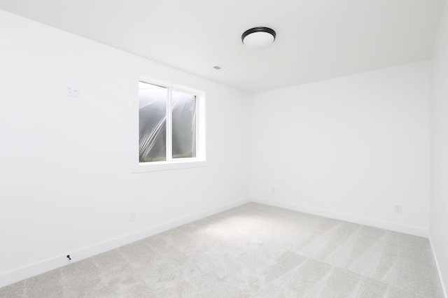 2500 NE 6th St, Grimes, IA 50111 - spare room with carpet flooring and baseboards