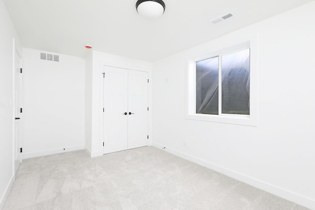 2500 NE 6th St, Grimes, IA 50111 - unfurnished bedroom featuring carpet flooring, baseboards, and a closet