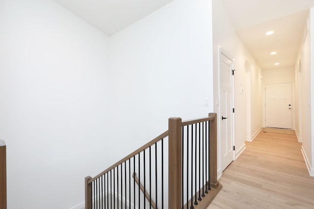 2500 NE 6th St, Grimes, IA 50111 - corridor with light wood finished floors, recessed lighting, an upstairs landing, and baseboards