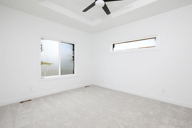 2500 NE 6th St, Grimes, IA 50111 - unfurnished room featuring carpet floors, baseboards, a raised ceiling, and ceiling fan