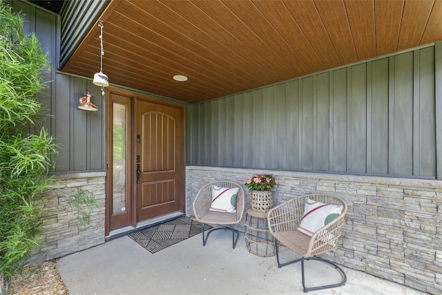 6935 NW 88th Ave, Johnston, IA 50131 - entrance to property featuring stone siding and board and batten siding