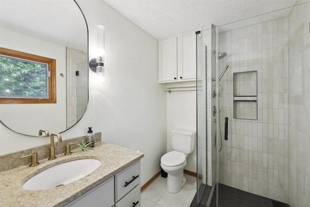 6935 NW 88th Ave, Johnston, IA 50131 - full bathroom with toilet, vanity, a tile shower, tile patterned floors, and baseboards