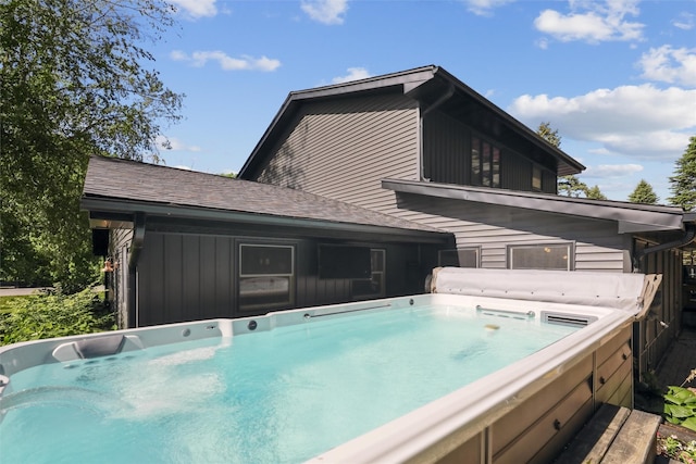 6935 NW 88th Ave, Johnston, IA 50131 - rear view of property featuring a hot tub