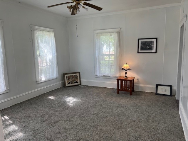 520 S Main St, Stuart, IA 50250 - carpeted empty room with crown molding, healthy amount of natural light, ceiling fan, and baseboards