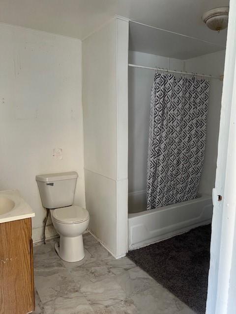 520 S Main St, Stuart, IA 50250 - full bathroom featuring toilet, vanity, shower / bath combination with curtain, and marble finish flooring