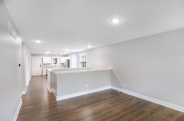 501 Kirkwood Ave, Des Moines, IA 50315 - unfurnished room featuring dark wood-type flooring and baseboards
